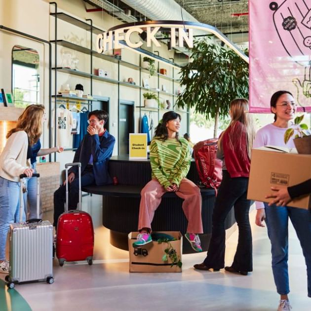 a group of people standing in a lobby